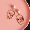 Artistic Hollow Face Pearl Earrings