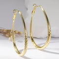 Golden Egg-Shaped Earrings